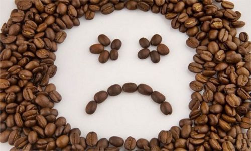 Унылая рожица из кофейных зерен